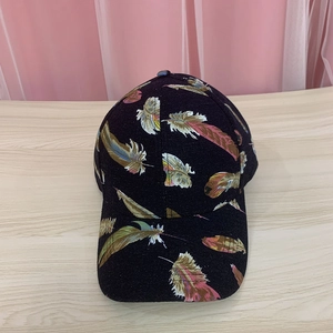 Black baseball cap with vibrant colorful feather prints and curved brim for outdoors