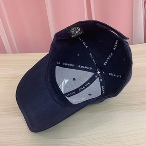 Detailed interior view of navy blue baseball cap showing branded seams and reinforced stitching