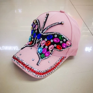 Pink baseball cap with large colorful rhinestone butterfly and sparkly sequined brim details