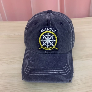 Detailed view of vintage washed navy cotton baseball cap with marine anchor embroidery patch