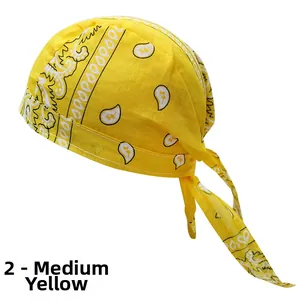 Close-up detail of medium yellow pirate headscarf with paisley pattern and adjustable straps