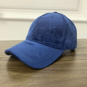 Detail of dark blue faux suede baseball cap showing reinforced stitching on the brim