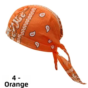 Detail view of orange paisley pirate bandana cap with adjustable ties for cycling