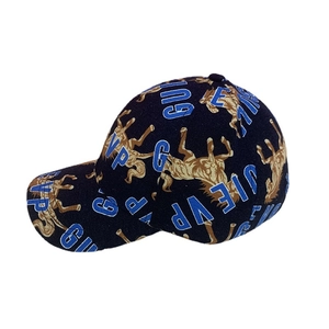 Navy blue baseball cap featuring golden horse patterns and vintage block letter prints