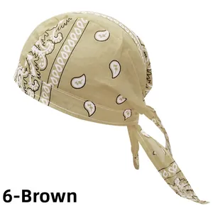 Close-up detail of beige paisley bandana showing breathable fabric texture and stitching