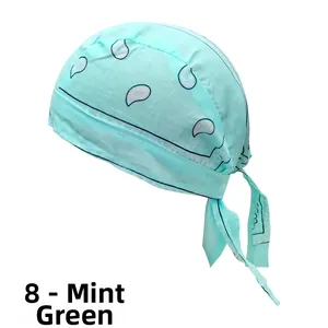 Detail of mint green paisley bandana showing breathable cotton fabric and tie-back closure