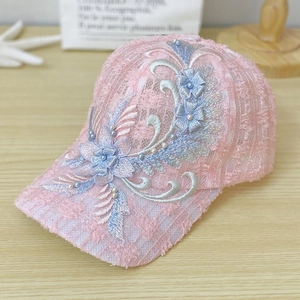 Detailed embroidery of 3D flowers and pearls on a pink lace baseball cap for women