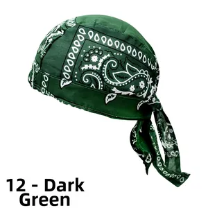 Detail of dark green paisley do-rag with white geometric patterns and adjustable straps