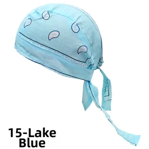Detail of lake blue bandana cap with white paisley print and adjustable back ties