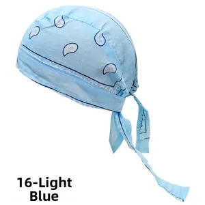 Detail of light blue cotton paisley bandana hat with adjustable tie-back straps