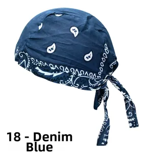 Detail of denim blue paisley pirate headwrap with adjustable straps and breathable fabric