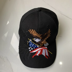 Detailed embroidery of an eagle and American flag on a black cotton baseball cap