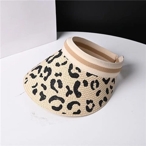 Detail of leopard print straw sun visor with elastic band and wide brim for summer