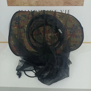 Detail of outdoor camouflage mosquito net hat featuring breathable mesh and adjustable drawcord