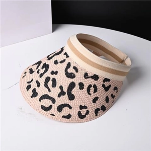 Detail of hand-woven leopard print straw sun visor with elastic band and wide brim