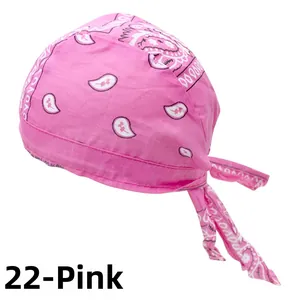 Detail of pink paisley cotton bandana with 100% Cotton stamp and tie-back design