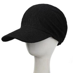 Close-up detail of black baseball cap with unique seersucker bubble texture fabric