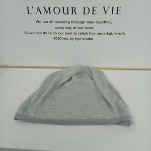 Unisex grey slouchy knit beanie hat with contrasting trim for autumn and winter wear