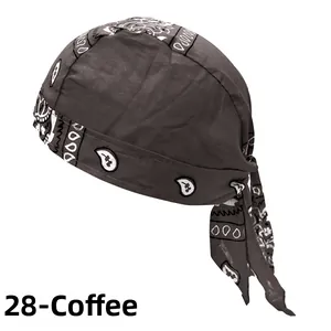 Detail of coffee brown cotton pirate hat featuring white paisley print and adjustable straps