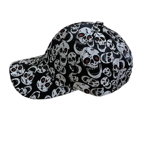 Classic black baseball cap with white skull patterns and red eye accents, side view
