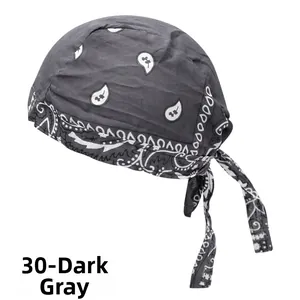 Detail view of dark grey paisley do-rag with adjustable straps and cotton texture