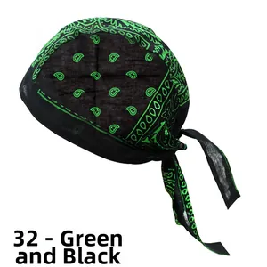 Close-up of black and green paisley pattern on a cotton cycling bandana with ties
