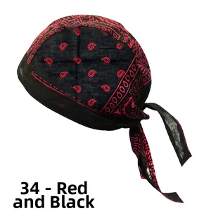 Detail view of the red and black paisley print on the lightweight cotton cycling bandana cap