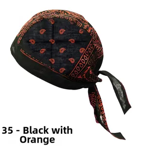 Detail of the black and orange paisley pattern fabric on this cycling durag headwear