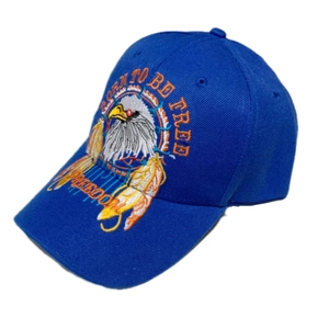 Detail of blue cotton baseball cap featuring eagle embroidery and Freedom slogan