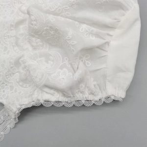 Elegant white lace sun hat for baby girls with detailed floral embroidery and scalloped edges