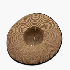 Women's wide brim woven straw hat with bow and elastic chin strap for sun protection