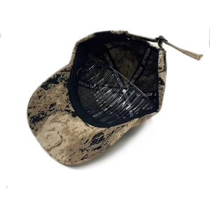 Detail view of camouflage baseball cap interior with FRCDOM logo and inner support