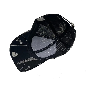 Detail view of polyester baseball cap featuring Eiffel Tower print and inner hat support