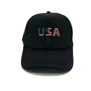Detailed front view of black trucker hat featuring USA letters and American flag pattern