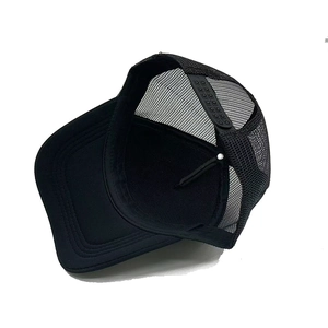 Detail view of the breathable mesh back and adjustable snapback closure on a black trucker hat