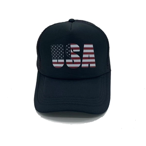 Detail of USA letters with American flag pattern on black mesh trucker baseball hat