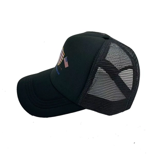 Classic black trucker hat with US flag shield logo and breathable mesh back panel