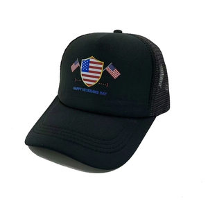 Detail of Happy Veterans Day text and American flag embroidery on black mesh trucker cap