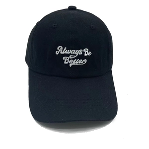Close-up of black cotton baseball cap featuring Always Be Better white embroidery