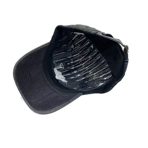 Detail view of the dark grey baseball cap showing metal buckle and inner cap mold