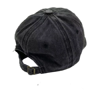 Detail of adjustable metal buckle strap on charcoal washed denim baseball cap