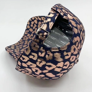 Women's navy baseball cap featuring rose gold metallic leopard print and adjustable buckle