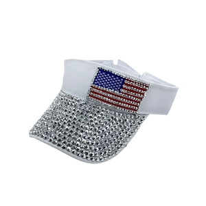 White sun visor hat with sparkling rhinestones and an American flag pattern on the brim