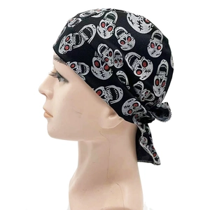 Detail of skull bandana with red glitter eyes and adjustable tie straps for cycling
