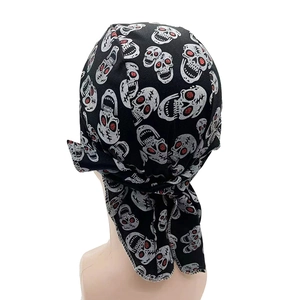 Detail of black pirate skull bandana featuring red glitter eyes and breathable fabric