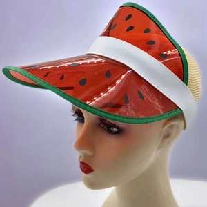 Detail of red PVC watermelon sun visor with green trim and white leather headband