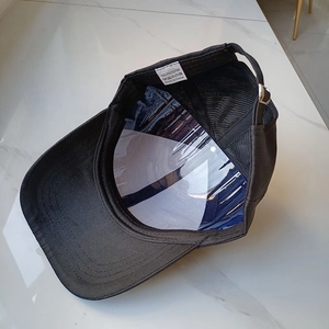 Black polyester baseball cap with rhinestones and mesh back featuring a metal adjustment buckle