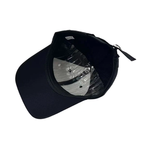 Classic black cotton baseball cap showing internal structure and adjustable metal buckle