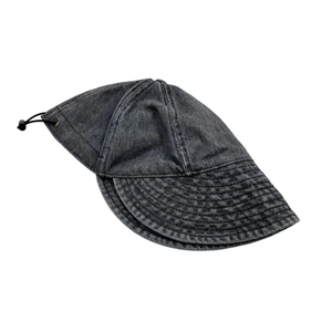 Detail view of washed denim bucket hat with wide brim, stitching and adjustable drawstring