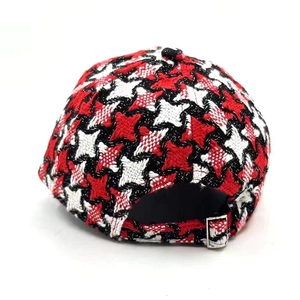 Detail of colorful houndstooth plaid baseball cap with silver metal adjustable buckle